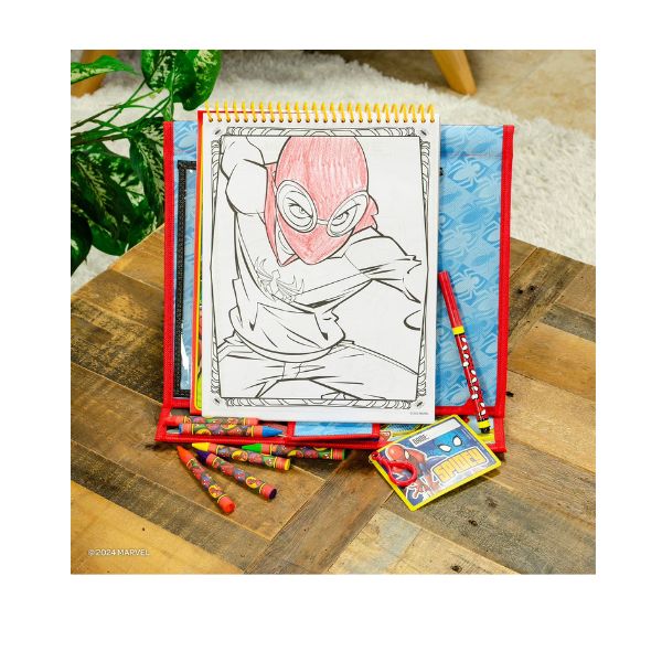 Coloring book with Spider-Man design on a wooden surface